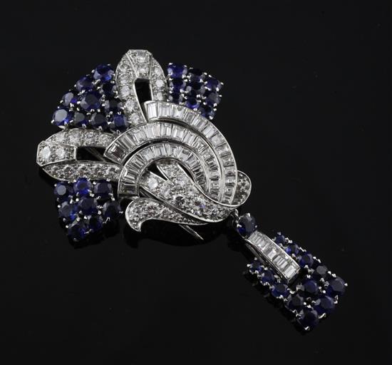 An attractive mid 20th century white gold, diamond and sapphire drop clip brooch, approx. 2.5in.